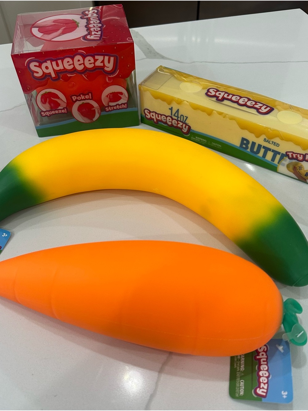 Sunny days set of 4 Squeezy toys Banana, Butter, strawberry & Carrot